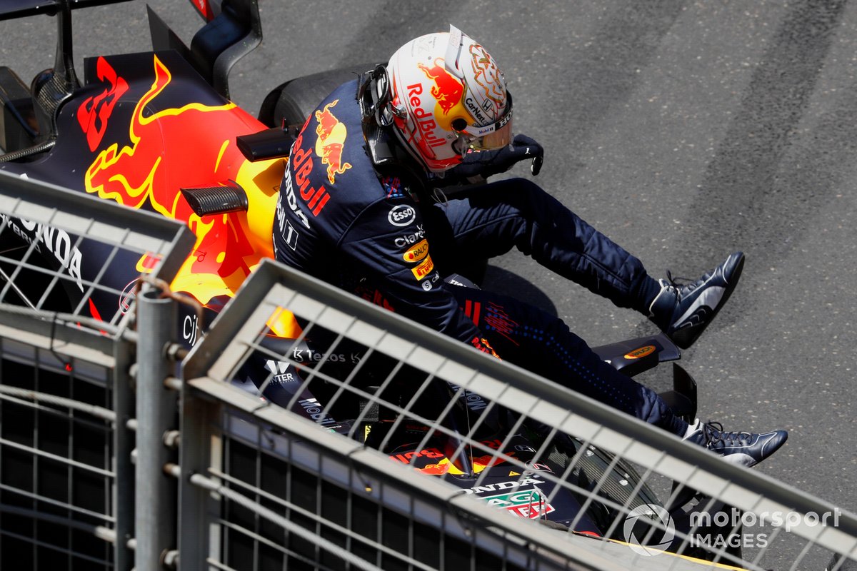 Max Verstappen, Red Bull Racing RB16B, climbs out of his car after hitting the wall