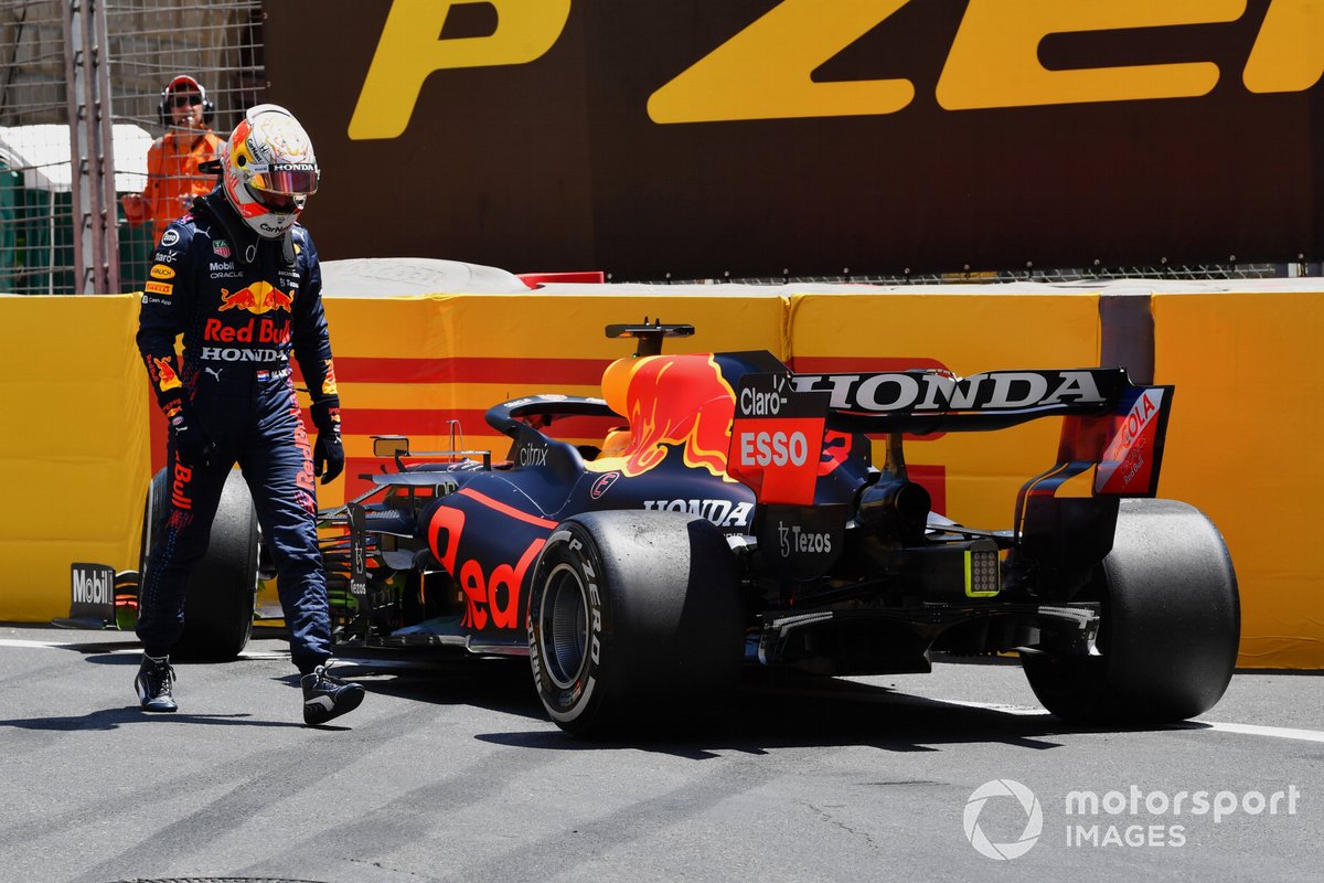 Max Verstappen, Red Bull Racing RB16B, inspects his car after a crash in FP3